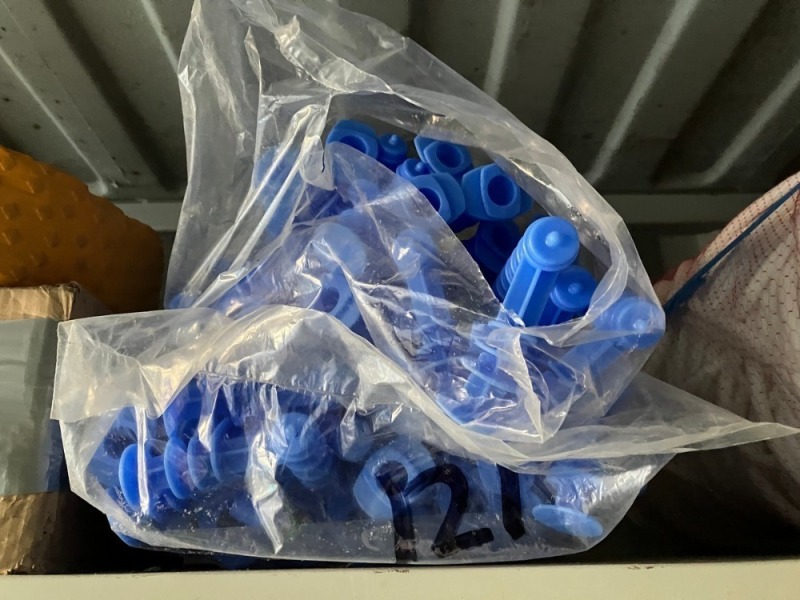 Assorted Items On Shelving And Hooks